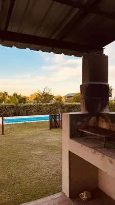 an outdoor grill with a view of a yard at La Calandria, Casa de campo in La Estancia