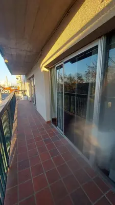 an empty balcony of a building with glass doors at Cofico Tradicional in Cordoba