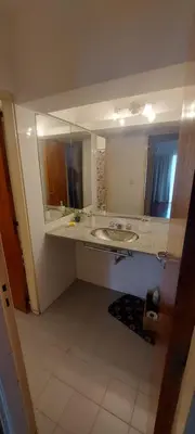 a bathroom with a sink and a large mirror at Cofico Tradicional in Cordoba