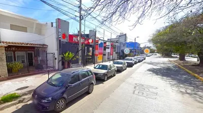 a row of cars parked on the side of a street at DEPARTAMENTO RIO TERCERO in Río Tercero