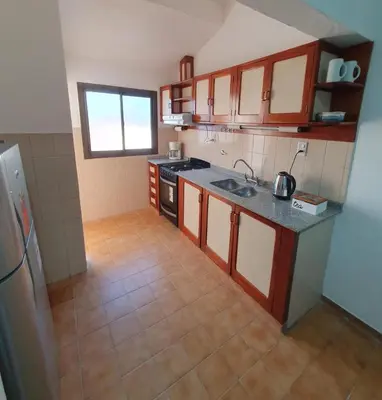 a kitchen with a sink and a counter top at DEPARTAMENTO RIO TERCERO in Río Tercero