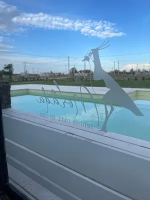 a sign on a window with a bird silhouette at La Morada Almafuerte in Almafuerte