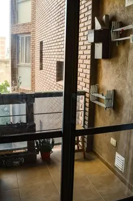 a view of a balcony from a window of a building at Departamento en Bv. San Juan in Cordoba