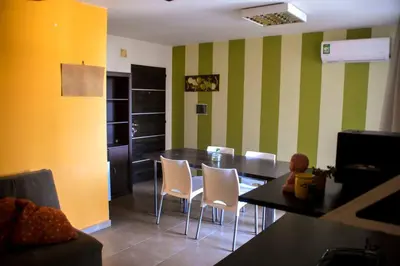 a dining room with a table and chairs at Departamento en Bv. San Juan in Cordoba