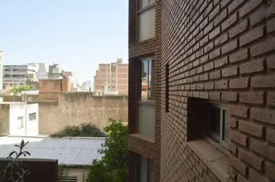 a brick building with a view of a city at Departamento en Bv. San Juan in Cordoba