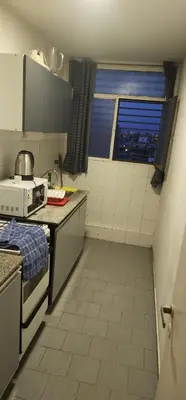 a small kitchen with a sink and a window at Cordoba Centro in Cordoba