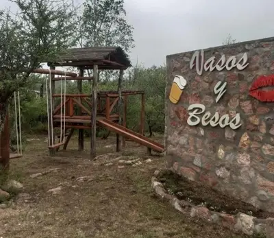 a picnic area with a picnic table and a sign at Cabaña 2 in Cordoba