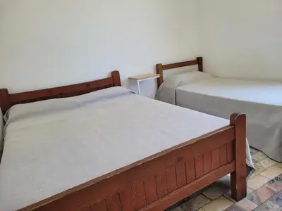 two twin beds in a room at Hotel CAMACHO in Cordoba