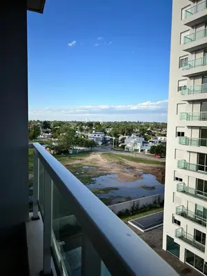 a balcony with a view of a city at Departamento 6 piso con piscina, de 1 dormitorio in Río Cuarto