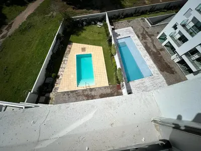 an aerial view of two swimming pools on a house at Departamento 6 piso con piscina, de 1 dormitorio in Río Cuarto
