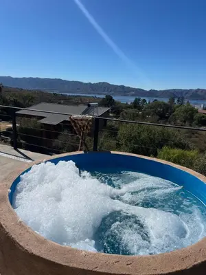 a hot tub filled with snow in a yard at EL PALMAR in Villa Carlos Paz