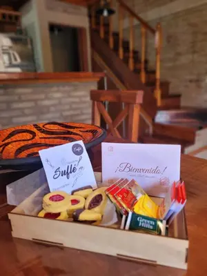 a box of cookies and other snacks on a table at Cabañas Brick House in Embalse