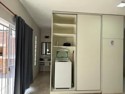 a white cabinet with a monitor in a room at Julias House in Almafuerte