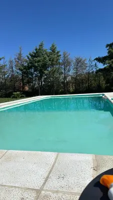 a large swimming pool with blue water at Julias House in Almafuerte