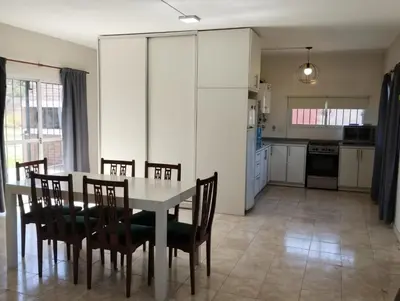 a kitchen and dining room with a table and chairs at Julias House in Almafuerte
