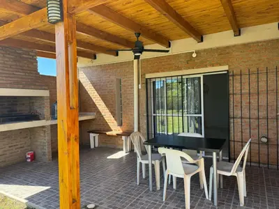 a patio with a black table and chairs at Julias House in Almafuerte