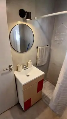 a bathroom with a sink and a mirror at Casa de Montaña in Cortaderas