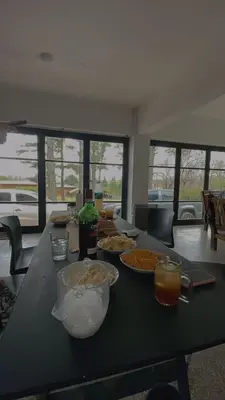 a table with plates of food and drinks on it at CASA EN SANTA ROSA DE CALAMUCHITA in Santa Rosa de Calamuchita