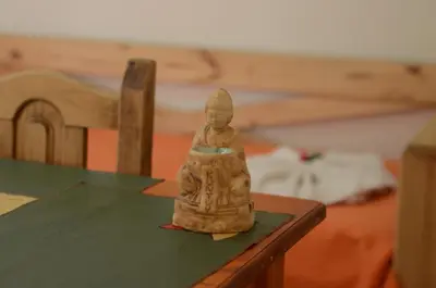 a small figurine sitting on top of a table at Cerros de la Villa in Villa Carlos Paz