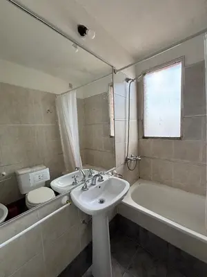 a bathroom with a sink and a tub and a toilet at Nueva Cordoba Illia 611 in Cordoba