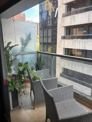 a bird flying through the air on a balcony at Nueva Cordoba Illia 611 in Cordoba