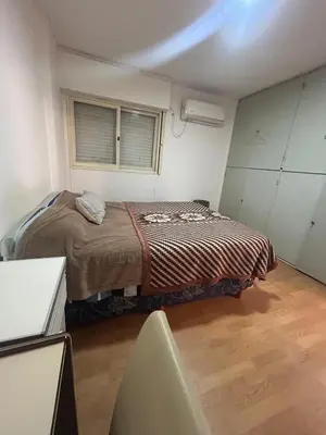 a small bedroom with a bed and a window at Richardson in Cordoba
