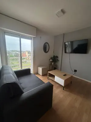 a living room with a couch and a table at Richardson in Cordoba
