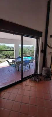 a room with a patio with a table and a grill at Ayen Hue Casa Vacacional en Mayu Sumaj in San Antonio de Arredondo