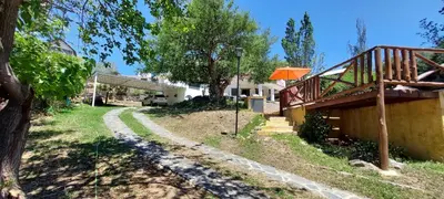 a house with a path next to a tree at Ayen Hue Casa Vacacional en Mayu Sumaj in San Antonio de Arredondo
