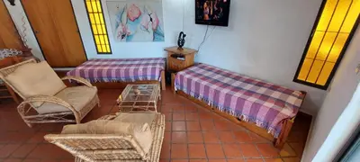 a living room with wicker chairs and a table at Ayen Hue Casa Vacacional en Mayu Sumaj in San Antonio de Arredondo