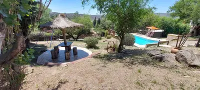 a backyard with a playground with a pool and a table at Ayen Hue Casa Vacacional en Mayu Sumaj in San Antonio de Arredondo