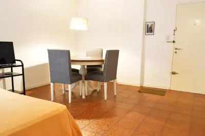 a dining room with a table and two chairs at Centro -Patio Olmos-home office - internet rápida- in Cordoba