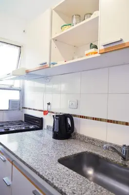 a kitchen with a sink and a counter top at Centro -Patio Olmos-home office - internet rápida- in Cordoba