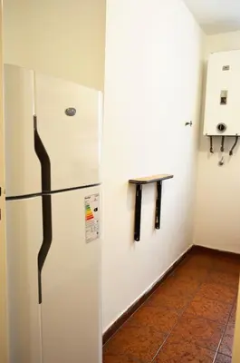 a kitchen with a refrigerator in a room at Centro -Patio Olmos-home office - internet rápida- in Cordoba