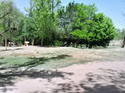 a park with trees and a dirt field with trees at AYRES DE MONTAÑA in San Ignacio