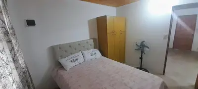 a small bedroom with a bed and a dresser at AYRES DE MONTAÑA in San Ignacio