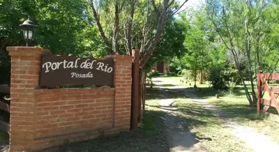 a sign that reads portal old rd dip pocket at Portal del Río Posada in Santa Rosa de Calamuchita