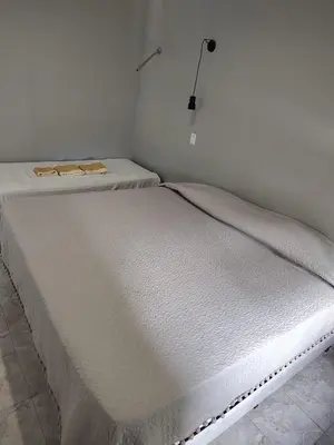 two white beds sitting in a room with at Departamento W R T 2 in Villa Carlos Paz