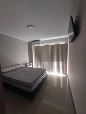 a bedroom with a bed and a window in a room at VENETO VILLAGE MR in Villa Parque Siquiman