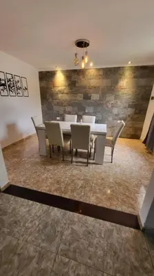 a dining room with a table and chairs at La Calera- Casa vacacional in La Calera