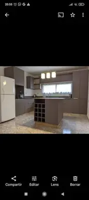 a kitchen with a white refrigerator and a counter top at La Calera- Casa vacacional in La Calera