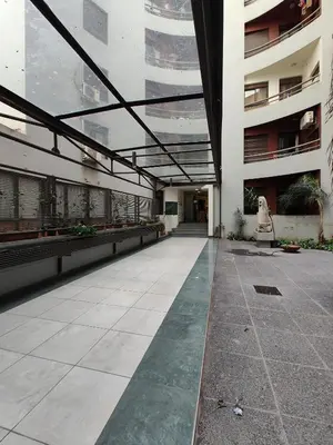 an empty courtyard of a building with a building at Hermoso departamento by Lofty in Cordoba