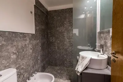 a bathroom with a sink and a toilet at Hermoso departamento by Lofty in Cordoba