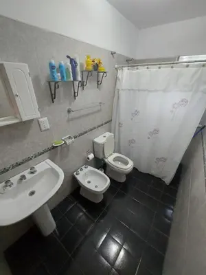 a bathroom with a toilet and a sink at Casa céntrica en Tanti in Tanti