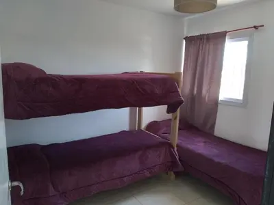 a room with two bunk beds and a window at Mi Descanso!!! in Cavalango