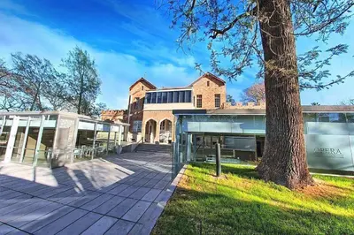 an exterior view of a building with a tree at OP Amoblado en Cordoba Capital in Cordoba