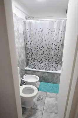 a small bathroom with a toilet and a shower at Hermosa Vista 2 in Cordoba