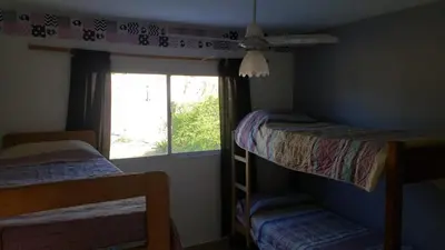 two bunk beds in a room with a window at Hermosa casa 351-6 en villa 157 carlos paz 157 - SOLO FAMILIAS in Villa Carlos Paz