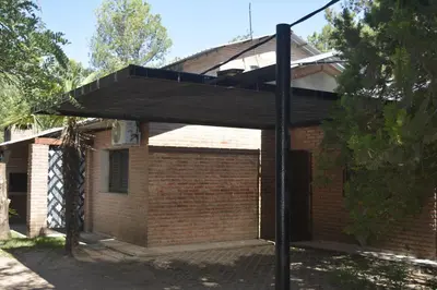 a black canopy in front of a brick building at Club Resort in Mina Clavero