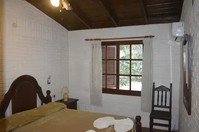 a bedroom with a bed and a window at Club Resort in Mina Clavero